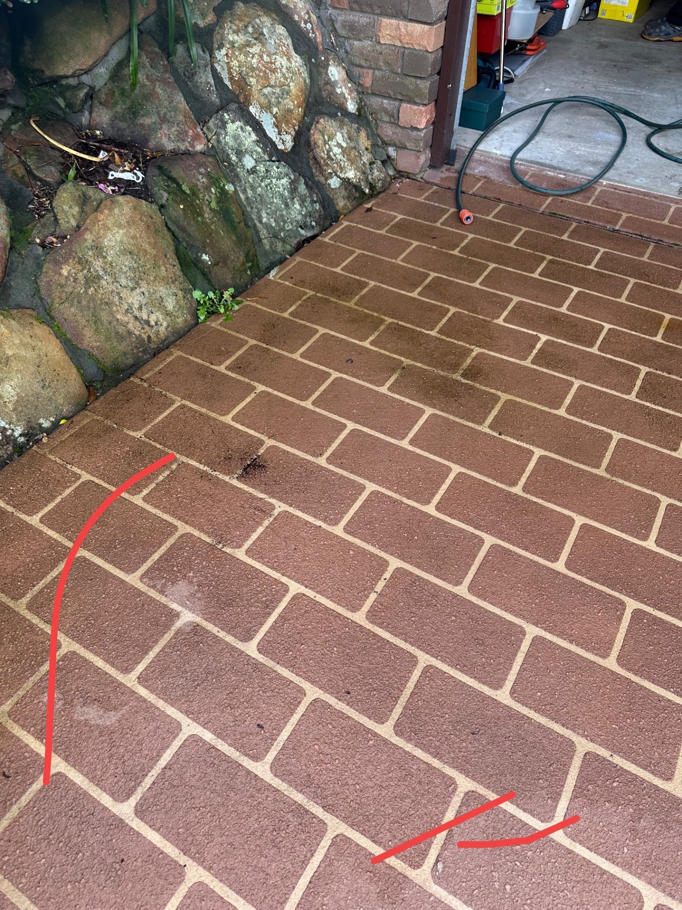 Brick paving close-up before and after pressure cleaning — before